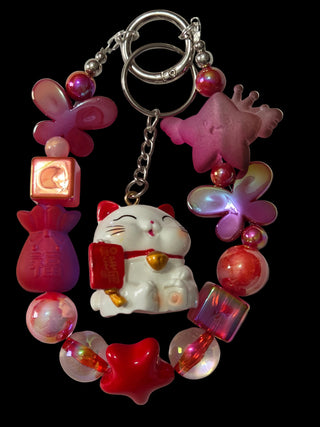 Red and green 3 d figure Keychains