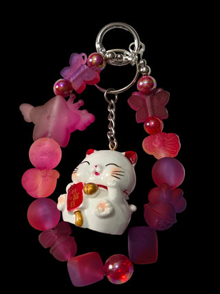 Red and green 3 d figure Keychains