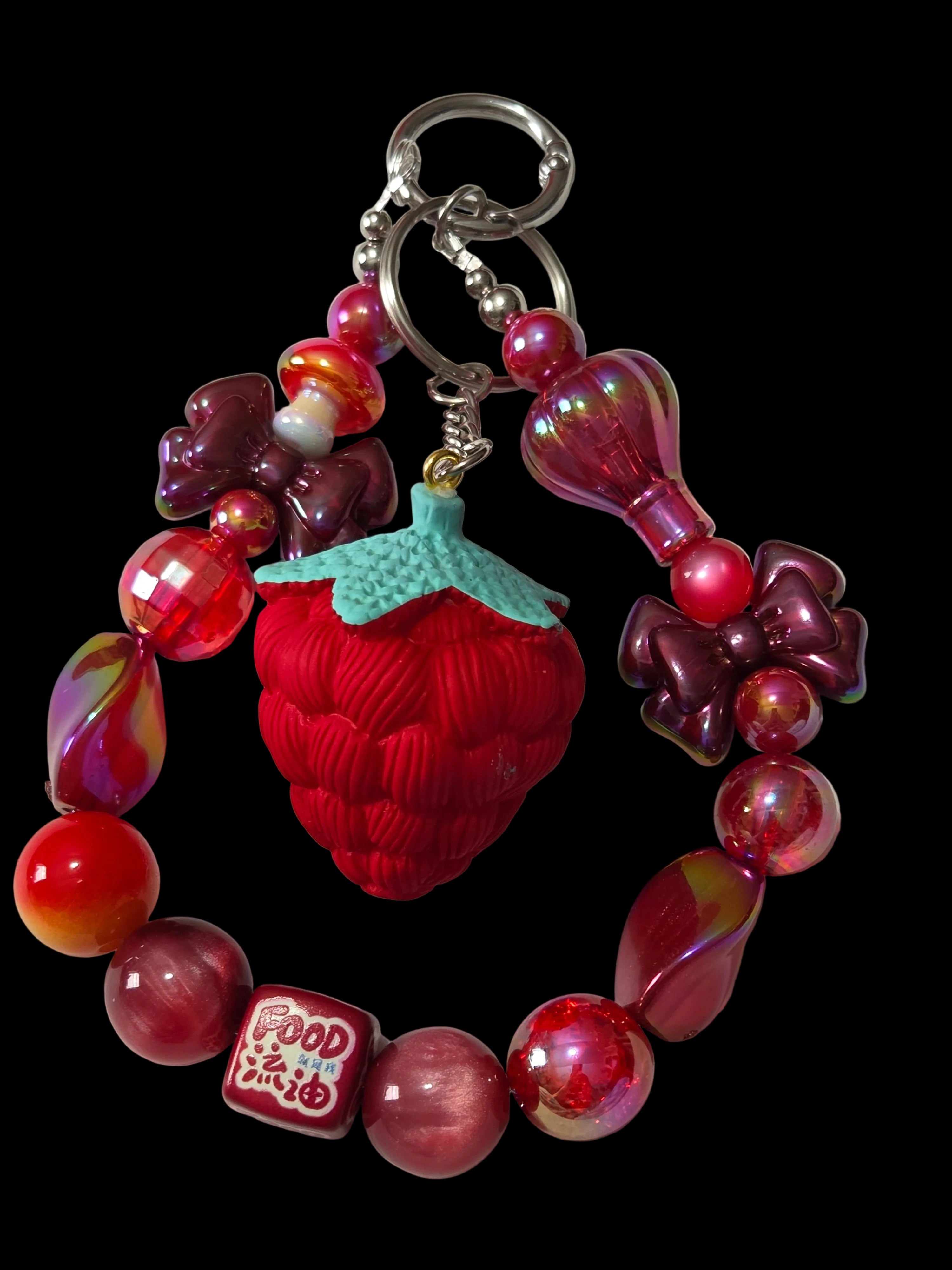 Red and green 3 d figure Keychains